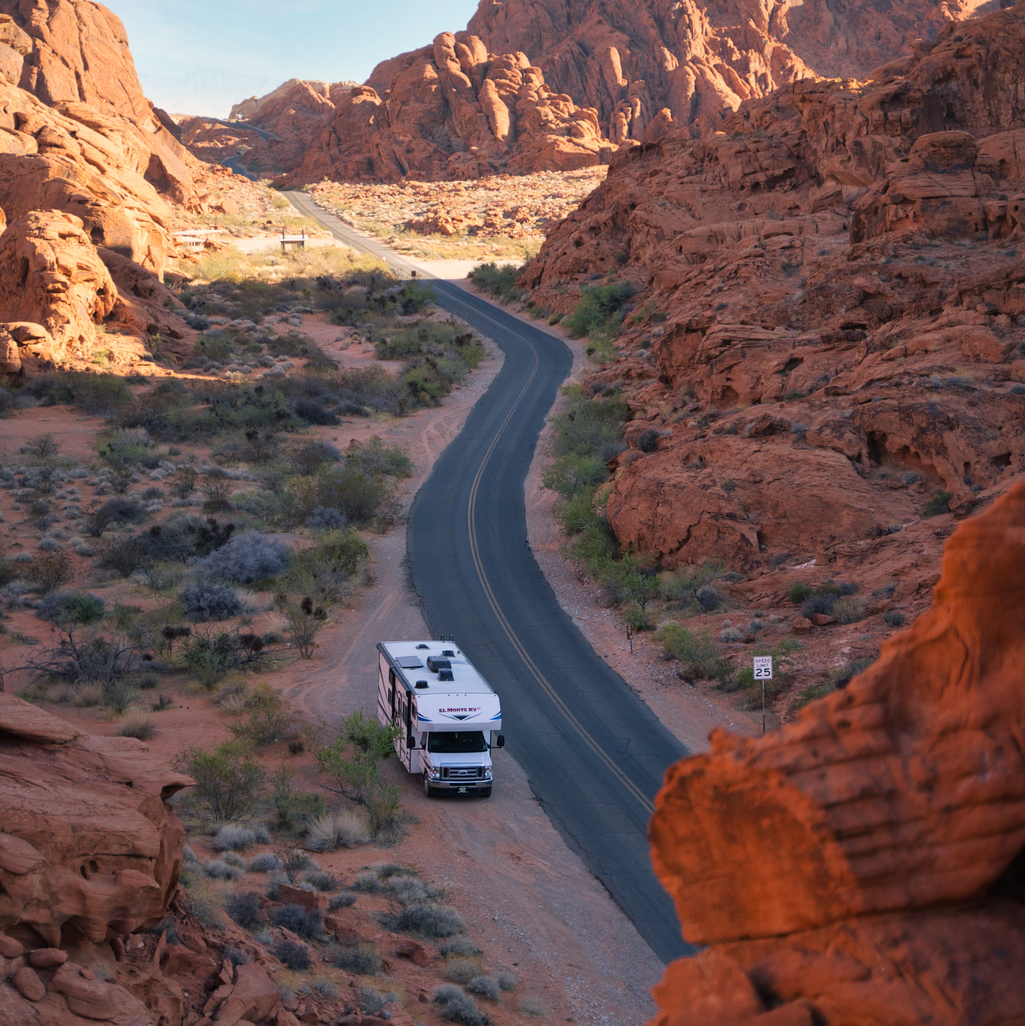 RV on red rock desert landscape near Arches National Park along a Utah road trip route